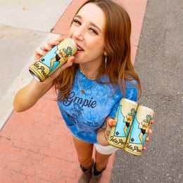 woman holding IdaPeach Seltzers