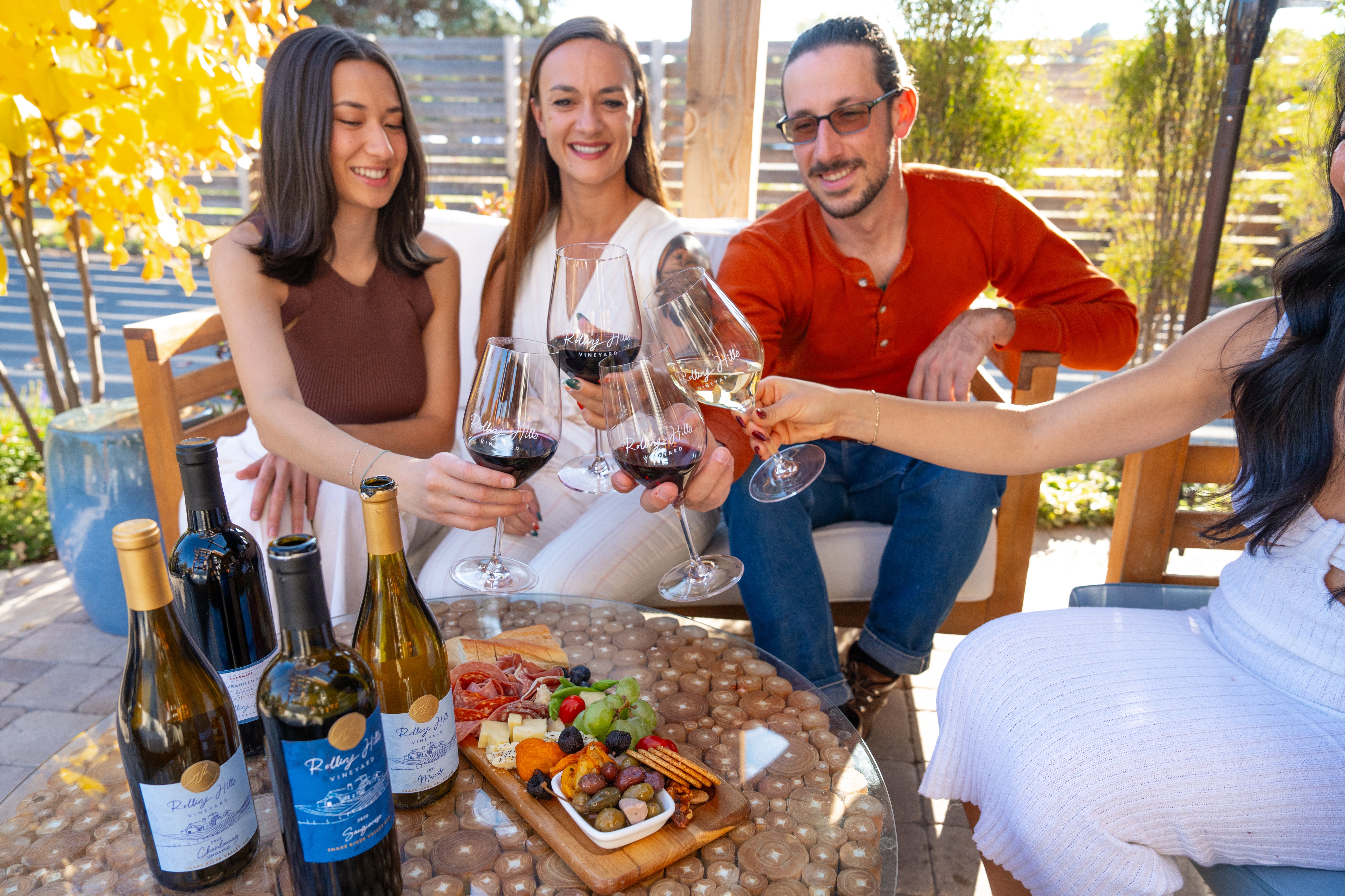 Friends drinking wine on Rolling Hills patio