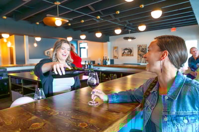 Idaho winemaker pouring woman Idaho red wine