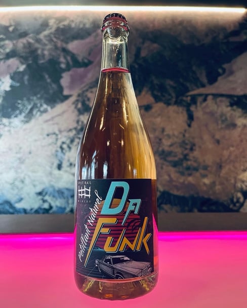 Bottle of De Funk Rosé Pét Nat Wine on table
