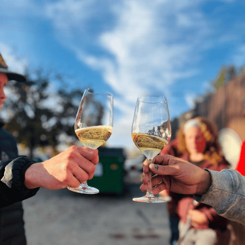 men from Telaya winery cheersing glasses of Idaho sparkling wine