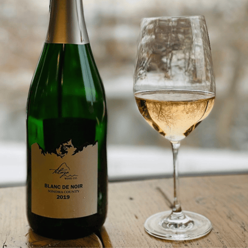 Bottle of Telaya’s Blanc De Noir with a glass of sparkling wine