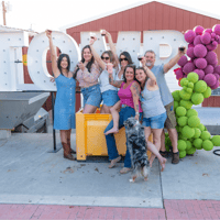 Women cheers at winery harvest event