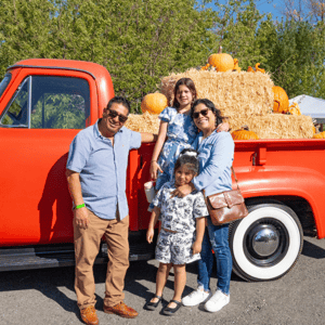 Family at idaho winery posing during harvest