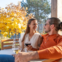 Couple with wine on Rolling Hills Winery patio