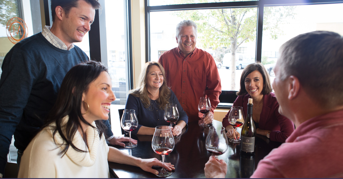 Friends gathering around wine in October