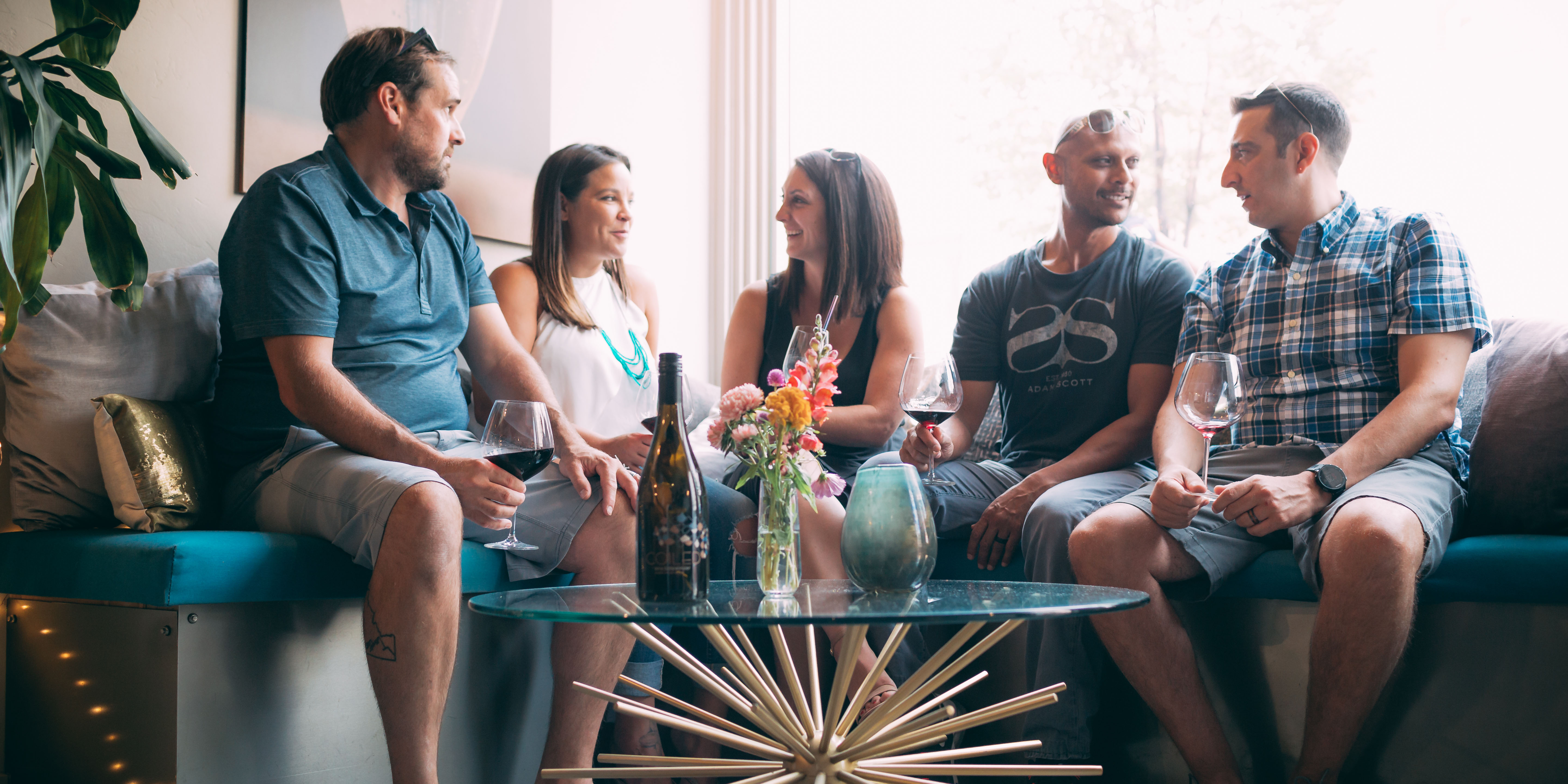 Group of five drinking wine at Coiled Wine Bar